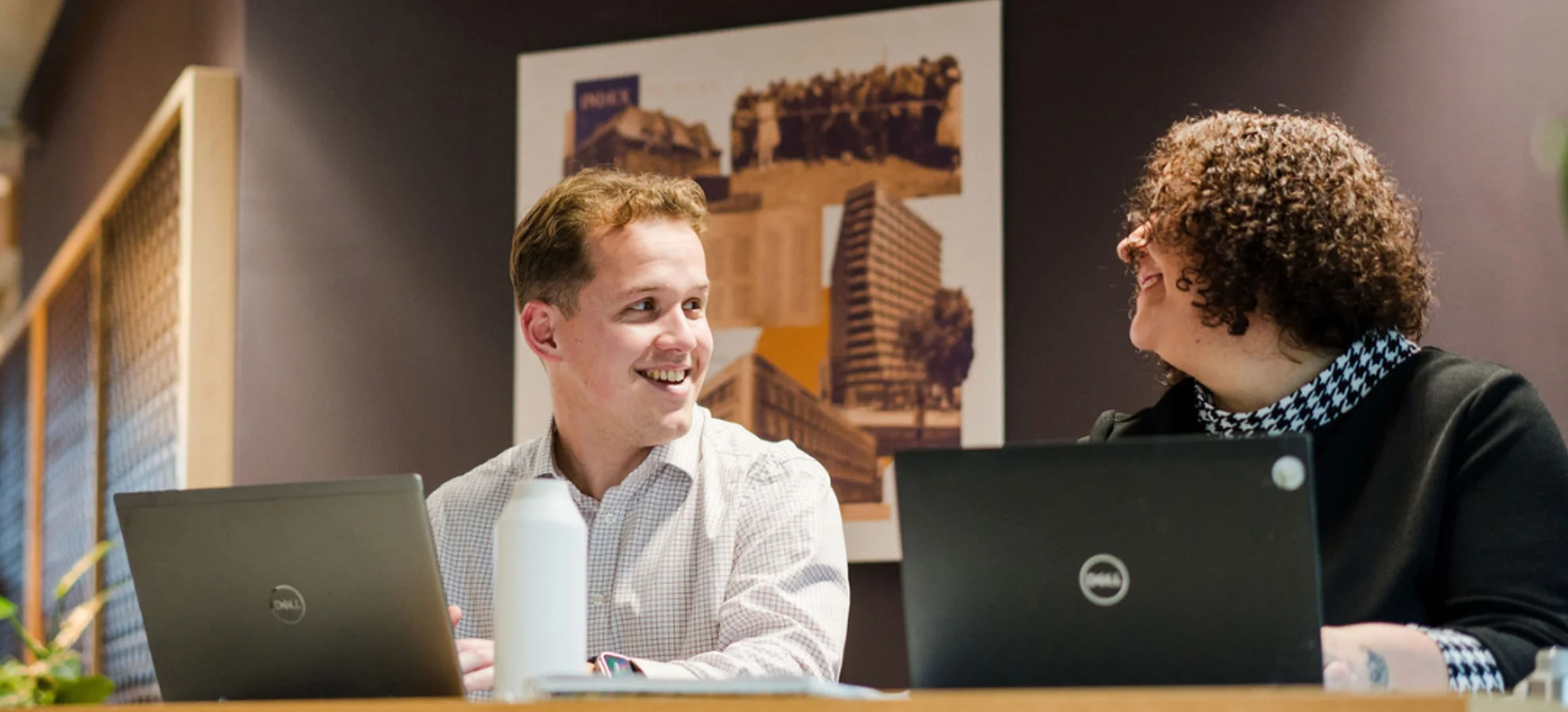 People Smiling At Desk (1)